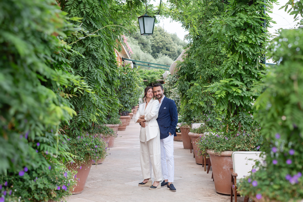 Elegant couple walking in the gardens of Hotel Splendido, Portofino